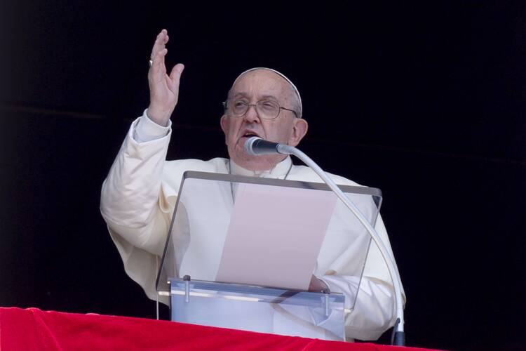 Pope Francis gives his blessing to people gathered in St. Peter's Square at the Vatican April 14, 2024, for his midday recitation of the "Regina Coeli" prayer. The pope pleaded with nations to exercise restraint and avoid an escalation of violence in the Middle East. (CNS photo/Vatican Media)