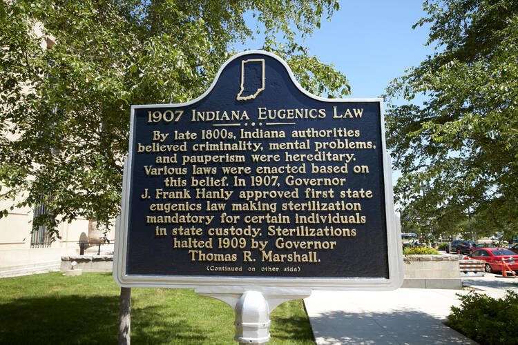 A marker in Indianapolis describes the history of a 1907 Indiana eugenics law