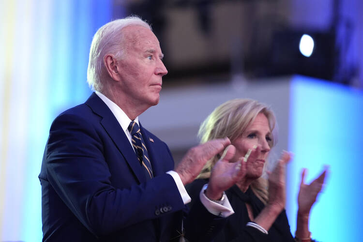 President Joe Biden and first lady Jill Biden appear on stage before Mr. Biden delivers remarks on the 75th anniversary of NATO at the Andrew W. Mellon Auditorium on July 9, 2024, in Washington, D.C. (AP Photo/Evan Vucci)
