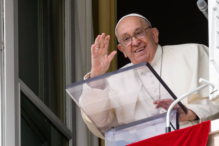 Pope Francis greets visitors gathered in St. Peter's Square to pray the Angelus at the Vatican Sept. 22, 2024. (CNS photo/Vatican Media)