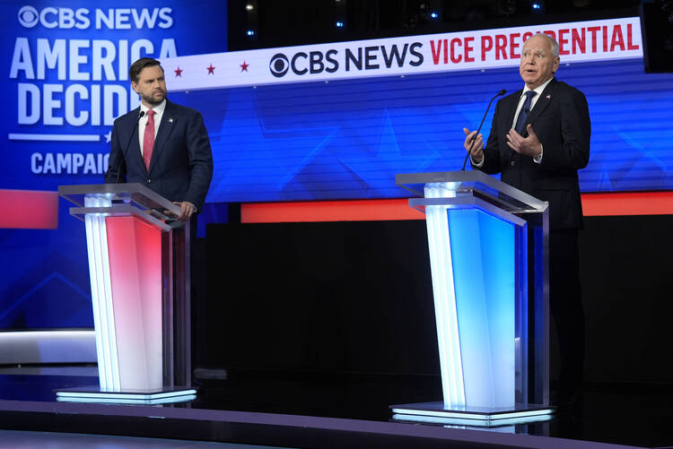Republican vice presidential nominee Sen. JD Vance of Ohio and Democratic vice presidential nominee Gov. Tim Walz of Minnesota participate in the vice presidential debate hosted by CBS News on Oct. 1, 2024, in New York. (AP Photo/Matt Rourke)