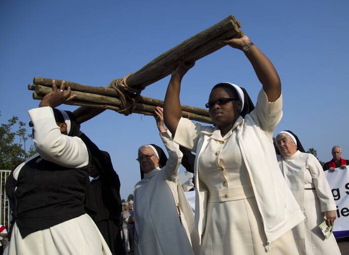 Sisters carry a cross during a silent march during Good Friday celebrations in Durban, South Africa, in March 2016. (CNS photo/Rogan Ward, Reuters)