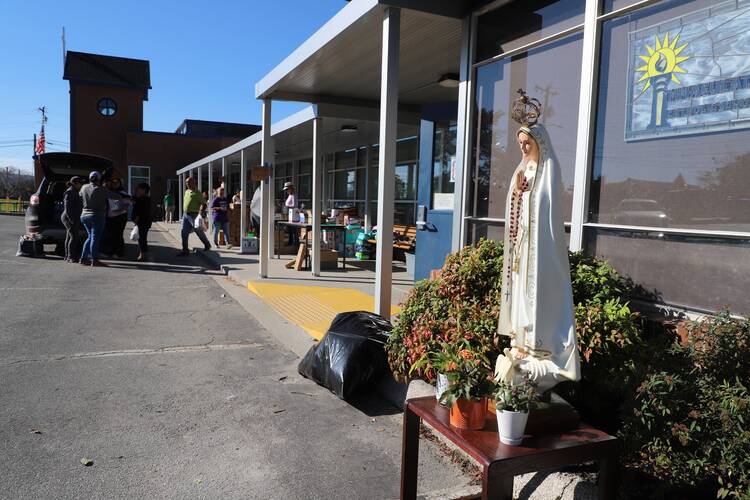 Hendersonville residents pull in for supplies outside Immaculata school. Photo by Kevin Clarke.