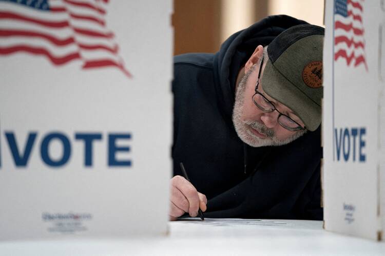 A man prepares to vote in the presidential primary in Superior, Wis., on April 2, 2024. (OSV News photo/Erica Dischino, Reuters)