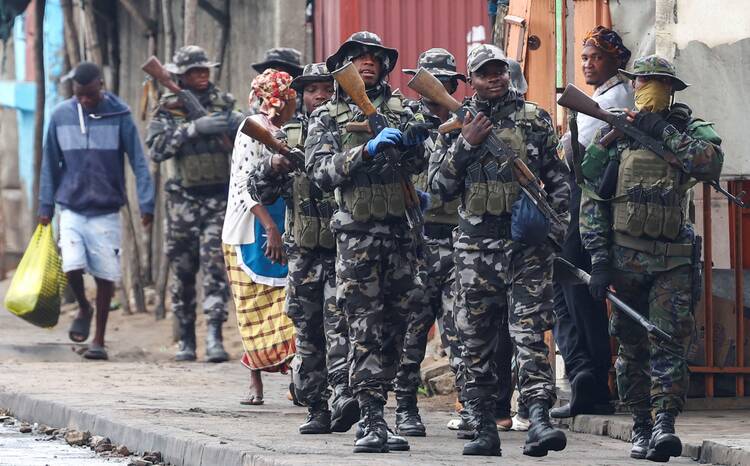 Members of the Mozambique military patrol the streets of Maputo, the nation's capital, on Nov. 8, 2024, a day after a “national shutdown” against protests over the outcome of general elections. (OSV News photo/Siphiwe Sibeko, Reuters)