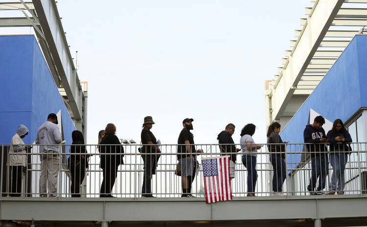 Voters wait to cast ballots at the Michelle and Barack Obama Sports Complex on Election Day, Nov. 5, 2024, in Los Angeles. (AP Photo/Chris Pizzello)