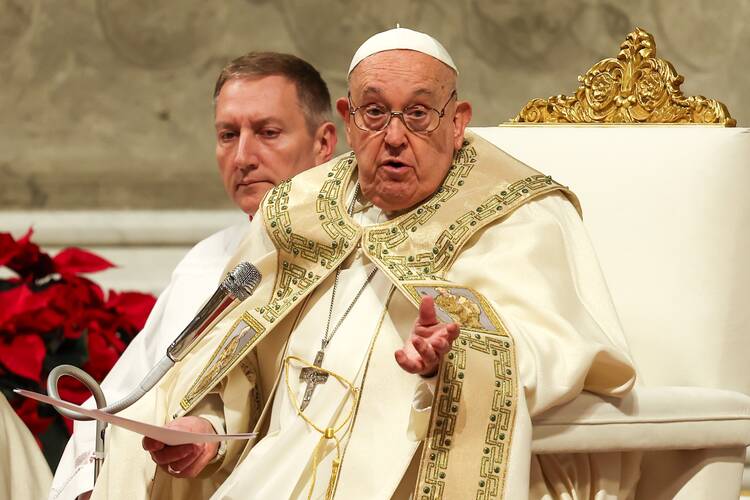 Pope Francis, after opening the Holy Door of St. Peter's Basilica at the Vatican, gives his homily during the Christmas Mass at Night Dec. 24, 2024. (CNS photo/Lola Gomez)