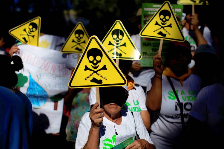 Protesters join a march convened by the Catholic Church in March 2017 to support a ban on mining in San Salvador, El Salvador. (CNS photo/Jose Cabezas, Reuters)