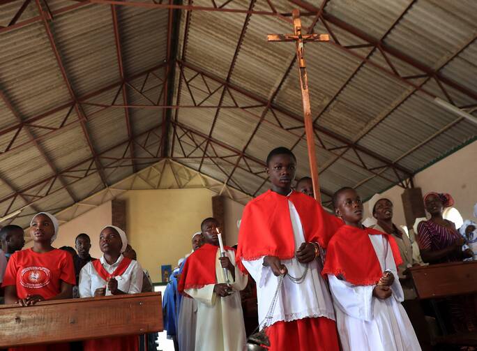 Altar servers lead a procession at the start of Mass in Marondera, Zimbabwe, Jan. 1, 2024. (OSV News photo/Philimon Bulawayo, Reuters)