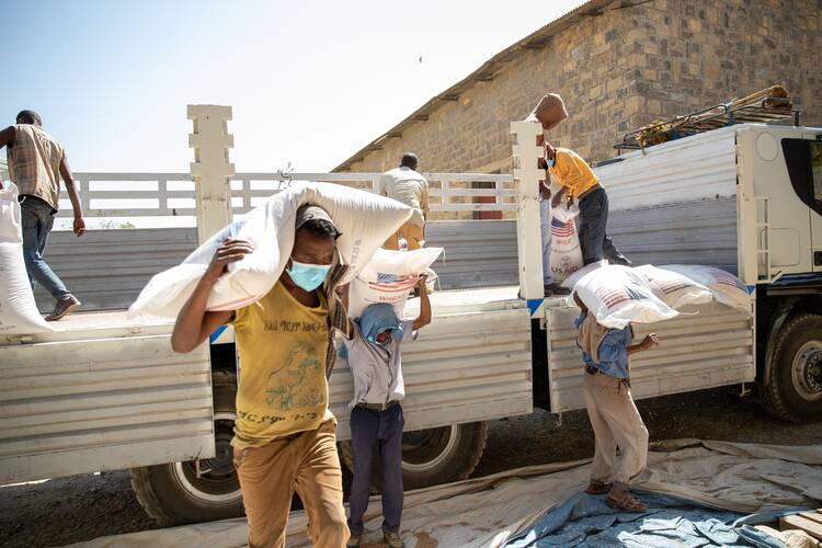 Workers carry food into a Catholic Relief Services warehouse near Mekele in Ethiopia's Tigray region Feb 15, 2021. (OSV News photo/Terhas Clark, CRS)