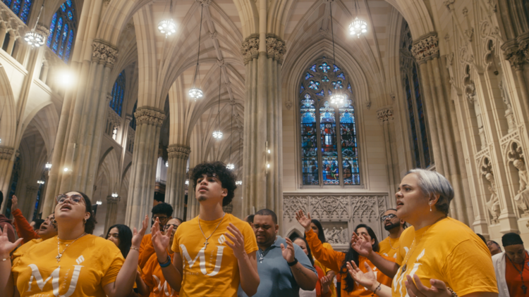 A group of Latino parishioners singing at Mass. Photo from the film "The Acolytes of the South Bronx," part of the series "Longing for More: Young Adult Hispanic Catholics." (Sabrina Avilés)