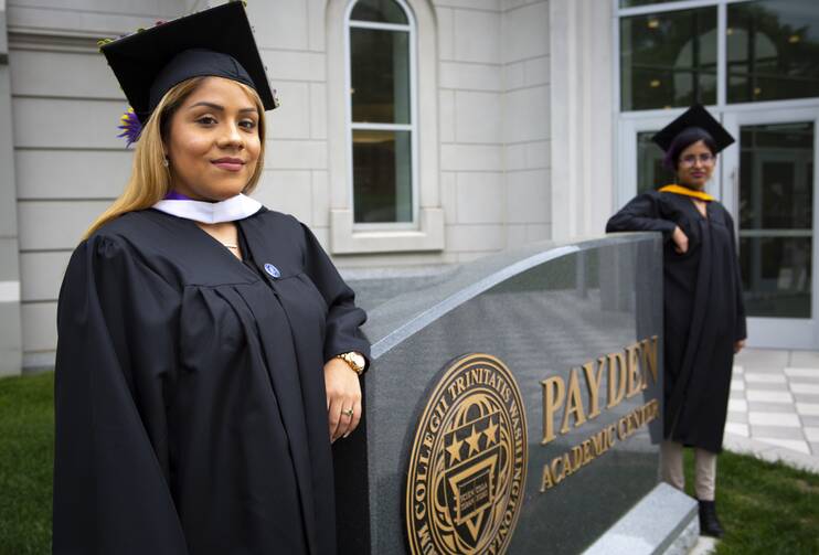 Brenda and Yarely—two "Dreamers" posing for a photo before their 2018 graduation from Trinity Washington University—consider themselves symbols of the Deferred Action for Childhood Arrivals program. (CNS photo/Chaz Muth)