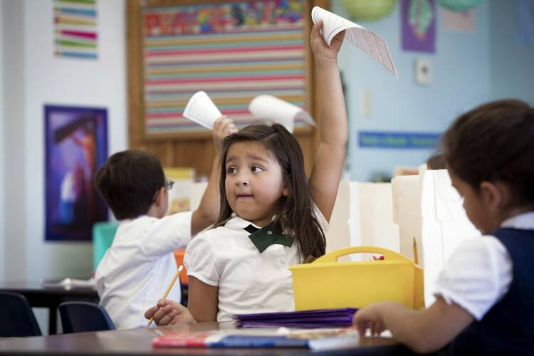 First-grade students finish an assignment at St. Ambrose Catholic School in Tucson, Ariz., in this 2014 photo. Arizona has one of the nation’s strongest school choice programs, with vouchers available to every child in the state. (CNS file photo/Nancy Wiechec)
