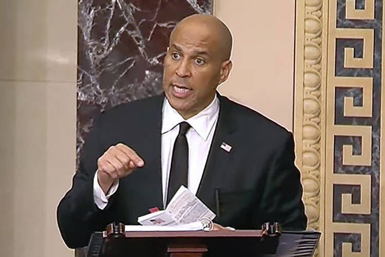In this image provided by Senate Television, Sen, Cory Booker, a Democrat from New Jersey, speaks on the Senate floor on April 1, 2025. The speech lasted 25 hours and four minutes, a record for the U.S. Senate. (Senate Television via AP)