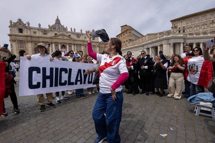 Peruvians celebrate as they join the pope for the 'Regina Coeli' prayer in St. Peter's Square at the Vatican on May 11, 2025. (CNS photo/Pablo Esparza)