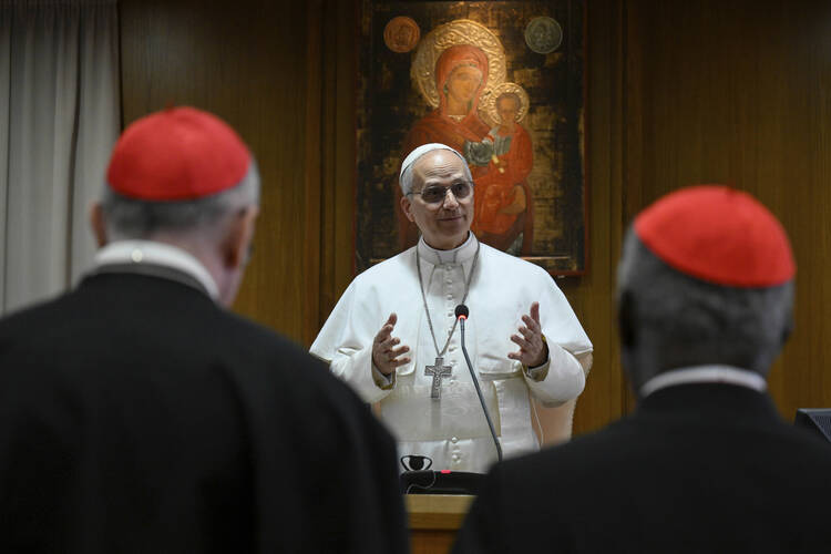 Pope Leo XIV meets the College of Cardinals in the New Synod Hall at the Vatican on May 10, 2025. In his remarks to the cardinals, the pope said that church teaching is relevant to “developments in the field of artificial intelligence that pose new challenges for the defense of human dignity, justice and labor.” (Vatican Media via AP)
