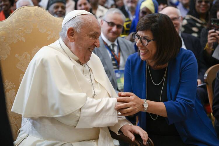 Pope Francis shares a laugh with Margaret Karram, president of the Focolare movement, at the end of a meeting with participants in an interreligious conference sponsored by the movement at the Vatican June 3, 2024. (CNS photo/Vatican Media)