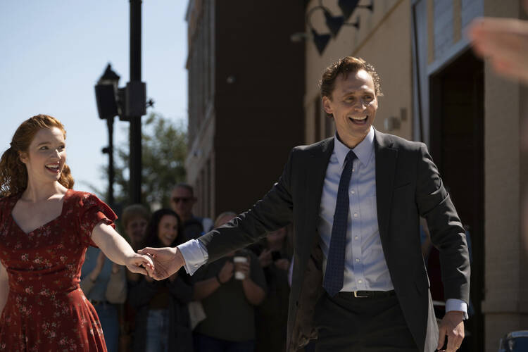 Annalise Basso, left, and Tom Hiddleston in a scene from "The Life of Chuck." (Neon via AP)