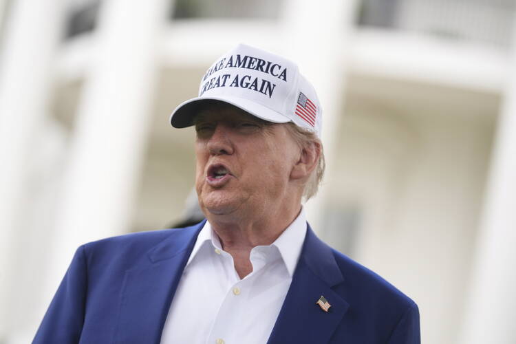 President Donald Trump speaks as a flag pole is installed on the South Lawn of the White House, Wednesday, June 18, 2025, in Washington. (AP Photo/Evan Vucci)