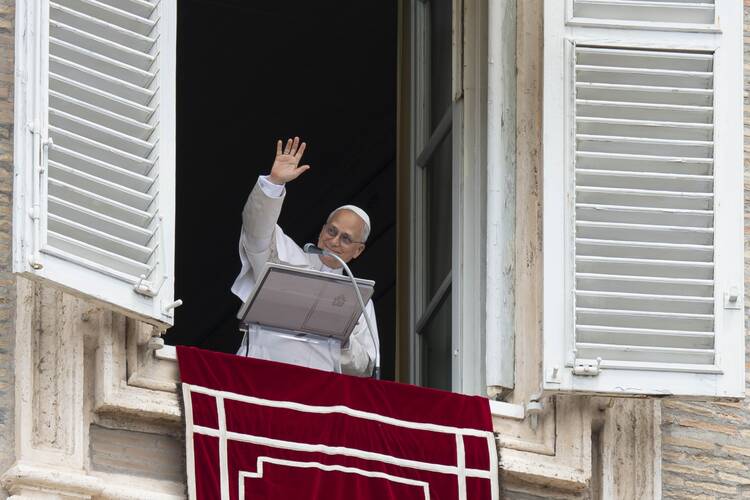 Pope Leo XIV waves to the crowd in St. Peter's Square at the Vatican as they join him for the recitation of the Angelus prayer and an appeal for peace hours after the U.S. bombed nuclear enrichment facilities in Iran on June 22. (CNS photo/Vatican Media)