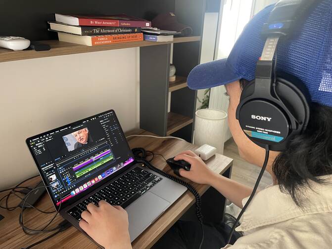 America Media’s Kevin Christopher Robles, studio production associate, at work in Rome in May. Photo by J.D. Long García.