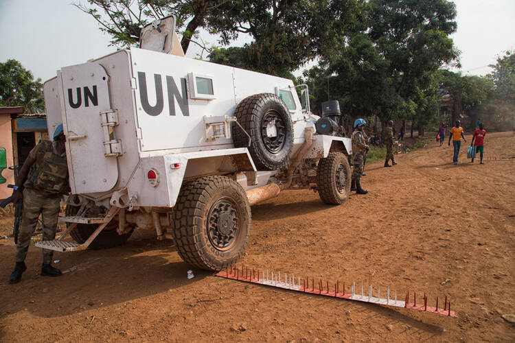 The police contingent of the UN Multidimensional Integrated Stabilization Mission in the Central African Republic (MINUSCA), along with the country’s National Police, conducting a joint operation in the capital Bangui. (UN Photo/Nektarios Markogiannis)