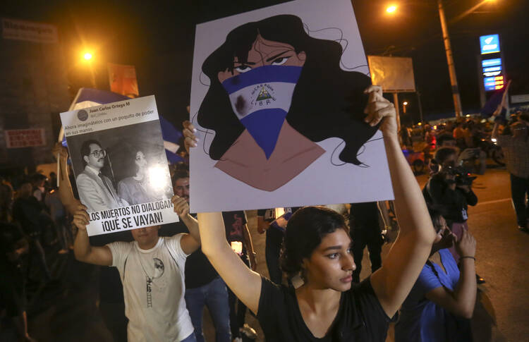 In this April 24, 2018 photo, demonstrators protest in honor of those who have died during anti-government protests in Managua, Nicaragua. (AP Photo/Alfredo Zuniga, File)