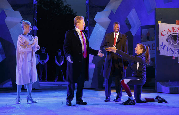 Tina Benko, left, portrays Melania Trump in the role of Caesar's wife, Calpurnia, and Gregg Henry, center left, portrays President Donald Trump in the role of Julius Caesar during a dress rehearsal of The Public Theater's Free Shakespeare in the Park production of Julius Caesar in New York. (Joan Marcus/The Public Theater via AP)
