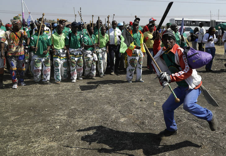 Mine workers sing during the commemoration ceremonies in Marikana, South Africa, on Aug. 16, 2017. Protestors complain that no one has been punished and conditions have not improved since Aug. 16, 2012, when police opened fire on workers demanding wage increases and better living conditions. (AP Photo/Themba Hadebe)