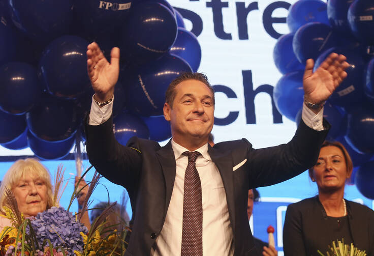 Hans-Christian Strache, leader of the strongly eurosceptic Austrian Freedom Party, waves to his supporters in Vienna, Austria, Sunday, Oct. 15, 2017, after the closing of the polling stations for the Austrian national elections. (AP Photo/Ronald Zak)