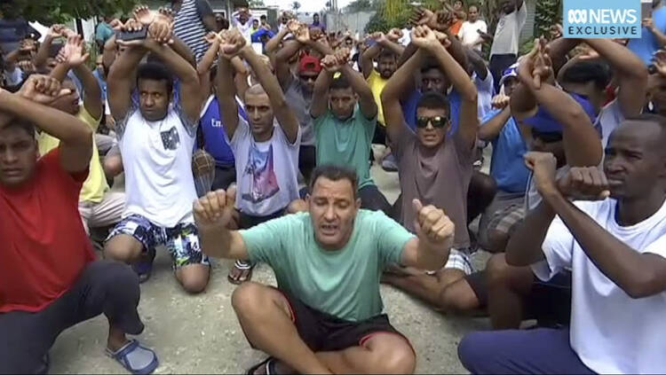 Asylum seekers protesting the possible closure of their detention center, on Manus Island, Paua New Guinea, on Tuesday, Oct. 31, 2017. (Australia Broadcasting Coroporation via AP)