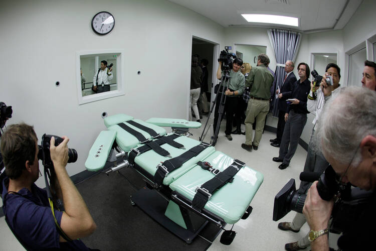 Journalists photograph the lethal injection facility at San Quentin State Prison in California in 2010. (AP Photo/Eric Risberg, File)