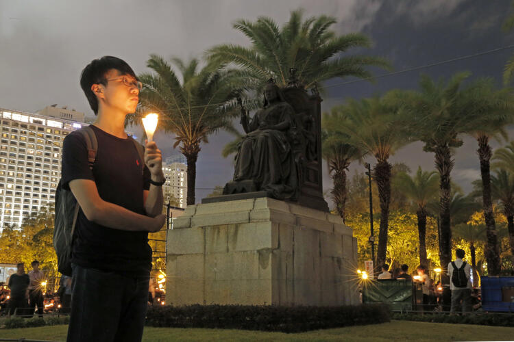 Thousands attended an annual candlelight vigil in Hong Kong on June 4 in Victoria Park, remembering the victims of the Tiananmen Square massacre in Beijing in 1989. (AP Photo/Kin Cheung)