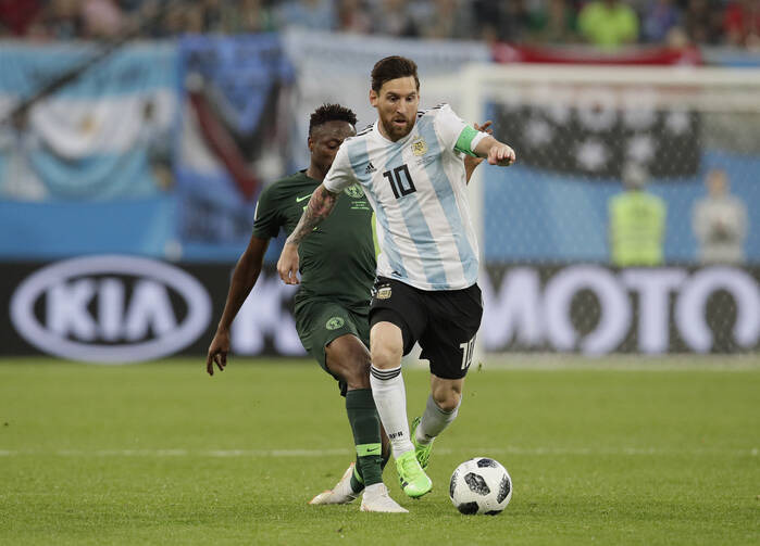 Argentina's Lionel Messi, front competes for the ball during the match between Argentina and Nigeria at the 2018 soccer World Cup in the St. Petersburg Stadium in St. Petersburg, Russia, on June 26. (AP Photo/Dmitri Lovetsky)