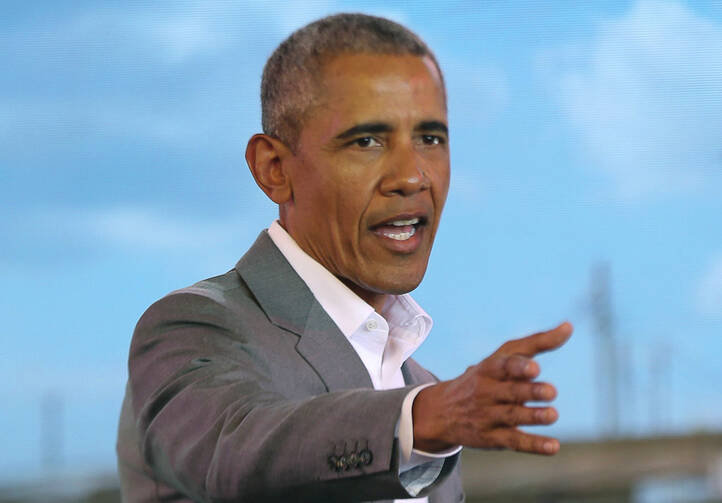 Former US President Barack Obama gestures to the crowd, during an event in Kogelo, Kisumu, Kenya, Monday, July 16, 2018. (AP Photo Brian Inganga)