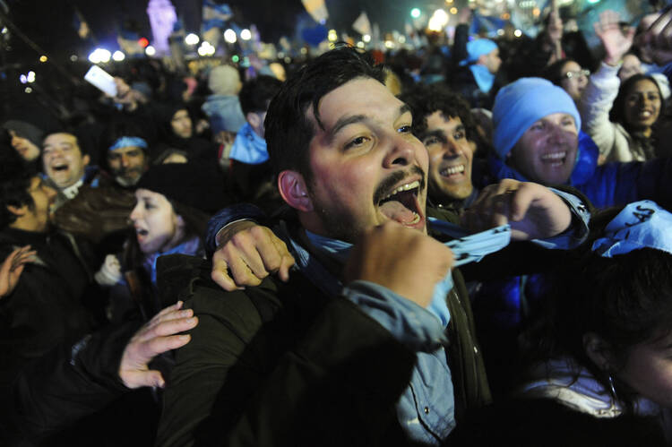 Demonstrators against decriminalizing abortion celebrate outside Congress in Buenos Aires, Argentina, Thursday, Aug. 9, 2018. (AP Photo/Luisa Balaguer)