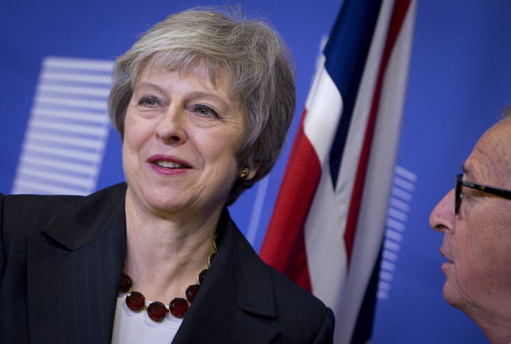 European Commission President Jean-Claude Juncker, right, greets British Prime Minister Theresa May at European Union headquarters in Brussels on Nov. 21, as the two leaders work to finalize a Brexit agreement. (AP Photo/Virginia Mayo)