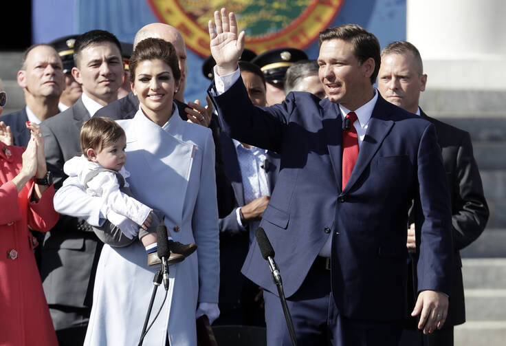 Florida Gov. Ron DeSantis waves during an inauguration ceremony with his wife Casey and son Mason on Jan. 8, in Tallahassee, Fla. (AP Photo/Lynne Sladky)