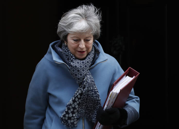 The staggering parliamentary defeat for Prime Minister Theresa May, seen here leaving 10 Downing Street on Jan. 23, pushed the country even further from safe dry land. (AP Photo/Alastair Grant)