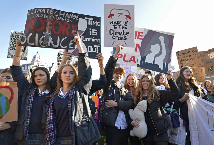 Students join the Youth Strike 4 Climate movement during a climate change protest near Parliament in London on Feb. 15. (Nick Ansell/PA via AP)