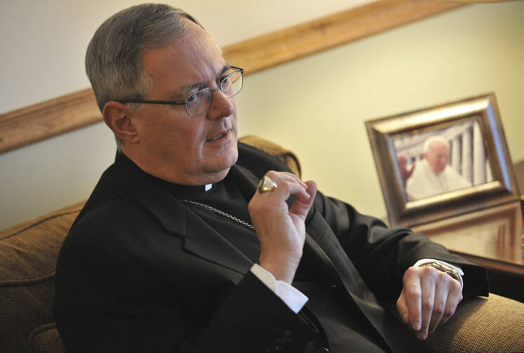 In this Nov. 22, 2009 file photo, Roman Catholic Bishop Thomas Tobin speaks to a reporter in Riverside, R.I. Tobin, Rhode Island's Roman Catholic bishop is facing backlash after tweeting Saturday, June 1, 2019 that Catholics should not support or attend LGBTQ Pride Month events. (AP Photo/Josh Reynolds, File)