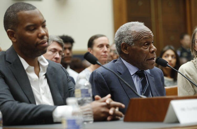 Actor Danny Glover, right, and author Ta-Nehisi Coates, left, testify about reparation for the descendants of slaves during a hearing before the House Judiciary Subcommittee on the Constitution, Civil Rights and Civil Liberties, at the Capitol in Washington, Wednesday, June 19, 2019. (AP Photo/Pablo Martinez Monsivais)