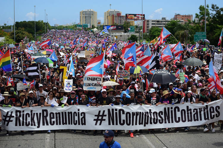 Thousands of Puerto Ricans joined one of the biggest protests ever seen in the U.S. territory, with irate islanders pledging to drive Gov. Ricardo Rossello from office, in San Juan, Puerto Rico on July 22. (AP Photo/Carlos Giusti)