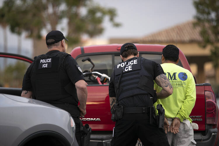  In this July 8, 2019 file photo, U.S. Immigration and Customs Enforcement (ICE) officers detain a man during an operation in Escondido, Calif. The administration of President Donald Trump announced Monday, July 22, 2019 that it will vastly expand the authority of immigration officers to deport migrants without allowing them to first appear before judges, its second major policy shift on immigration in eight days. Starting Tuesday, fast-track deportations can apply to anyone in the country illegally for les