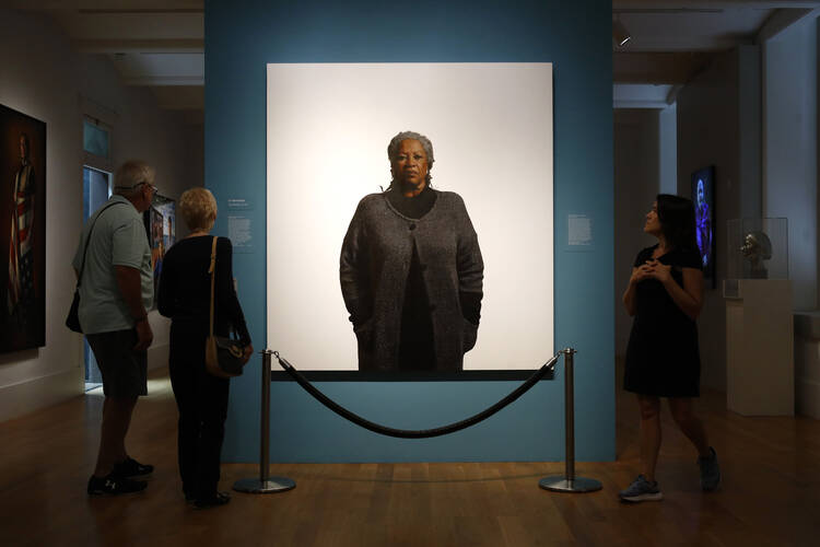 Visitors view a portrait of Nobel laureate Toni Morrison, painted by the artist Robert McCurdy, Tuesday, Aug. 6, 2019, at the National Portrait Gallery in Washington. Morrison, a pioneer and reigning giant of modern literature, died Monday at age 88.