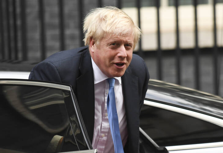 British Prime Minister Boris Johnson returns to Downing Street in London on Sept. 25. (AP Photo/Matt Dunham)