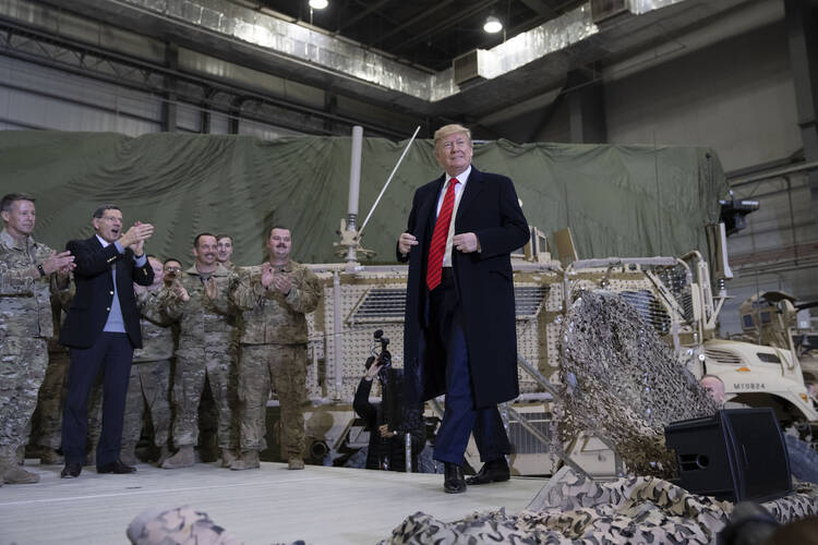 President Donald Trump at Bagram Air Field, Afghanistan, on Nov. 28, during a Thanksgiving Day visit. U.S. and international forces have been on the ground here ever since the terrorist attacks of Sept. 11, 2001. (AP Photo/Alex Brandon)