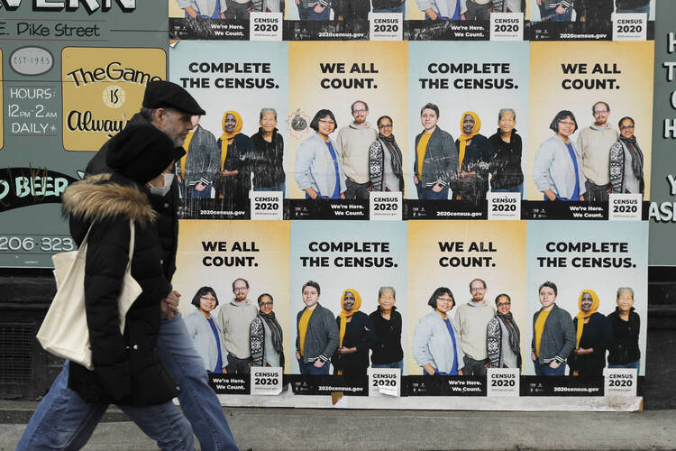 Posters encouraging participation in the 2020 census in Seattle’s Capitol Hill neighborhood. (AP Photo/Ted S. Warren)
