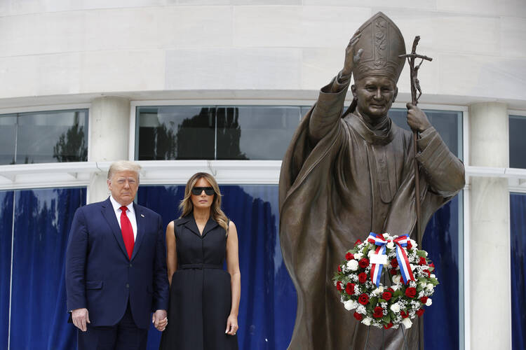 President Donald Trump and first lady Melania Trump visit the St. John Paul II National Shrine, in Washington, D.C., on June 2. (AP Photo/Patrick Semansky)