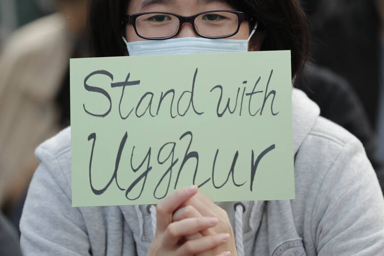 A Dec. 22, 2019, photo from a rally in Hong Kong to support the Uighurs, a Muslim minority group that has seen an estimated 1 million members detained in internment camps in China. (AP Photo/Lee Jin-man)